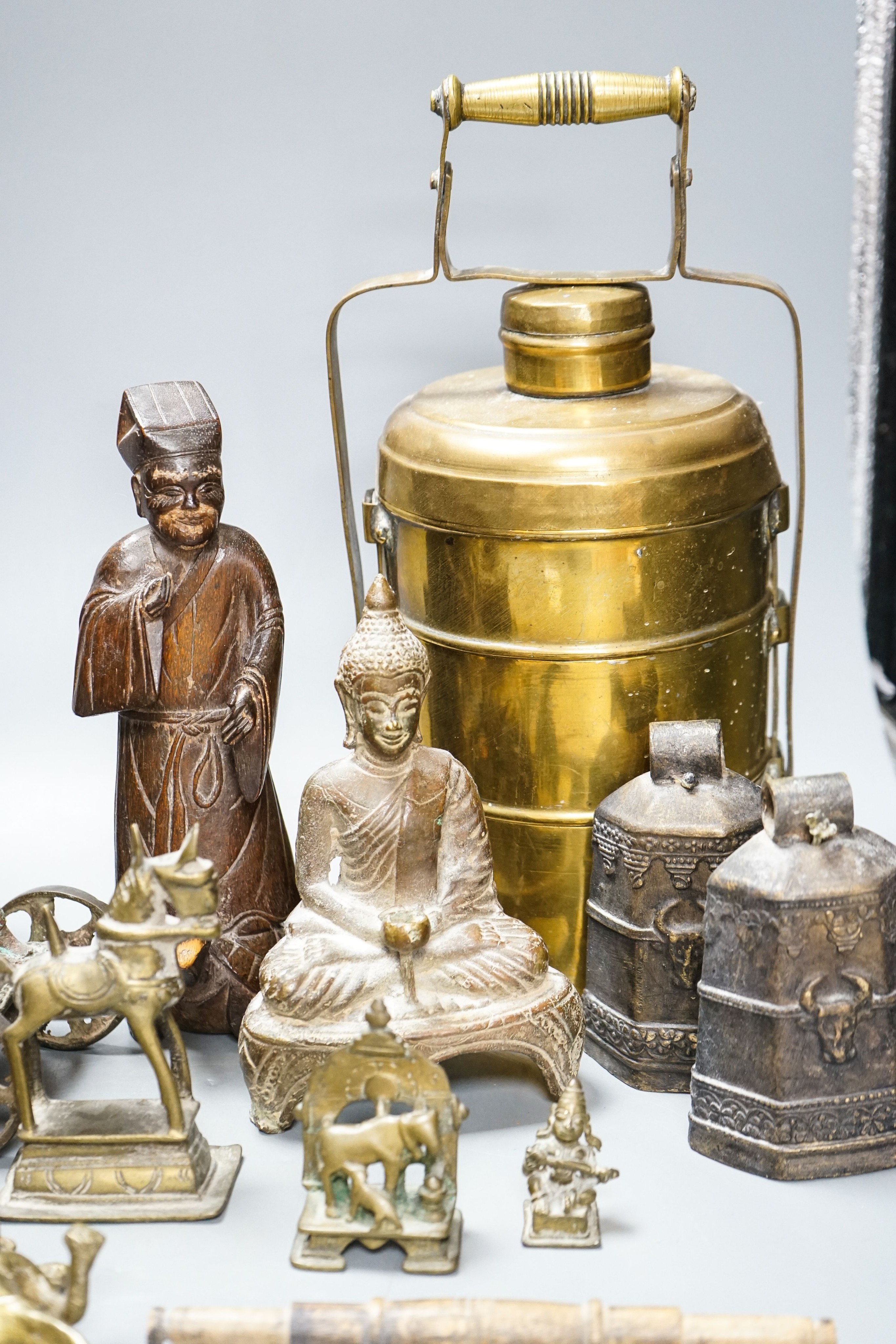 A group of Indian brass and wood figures and a Chinese wood figure